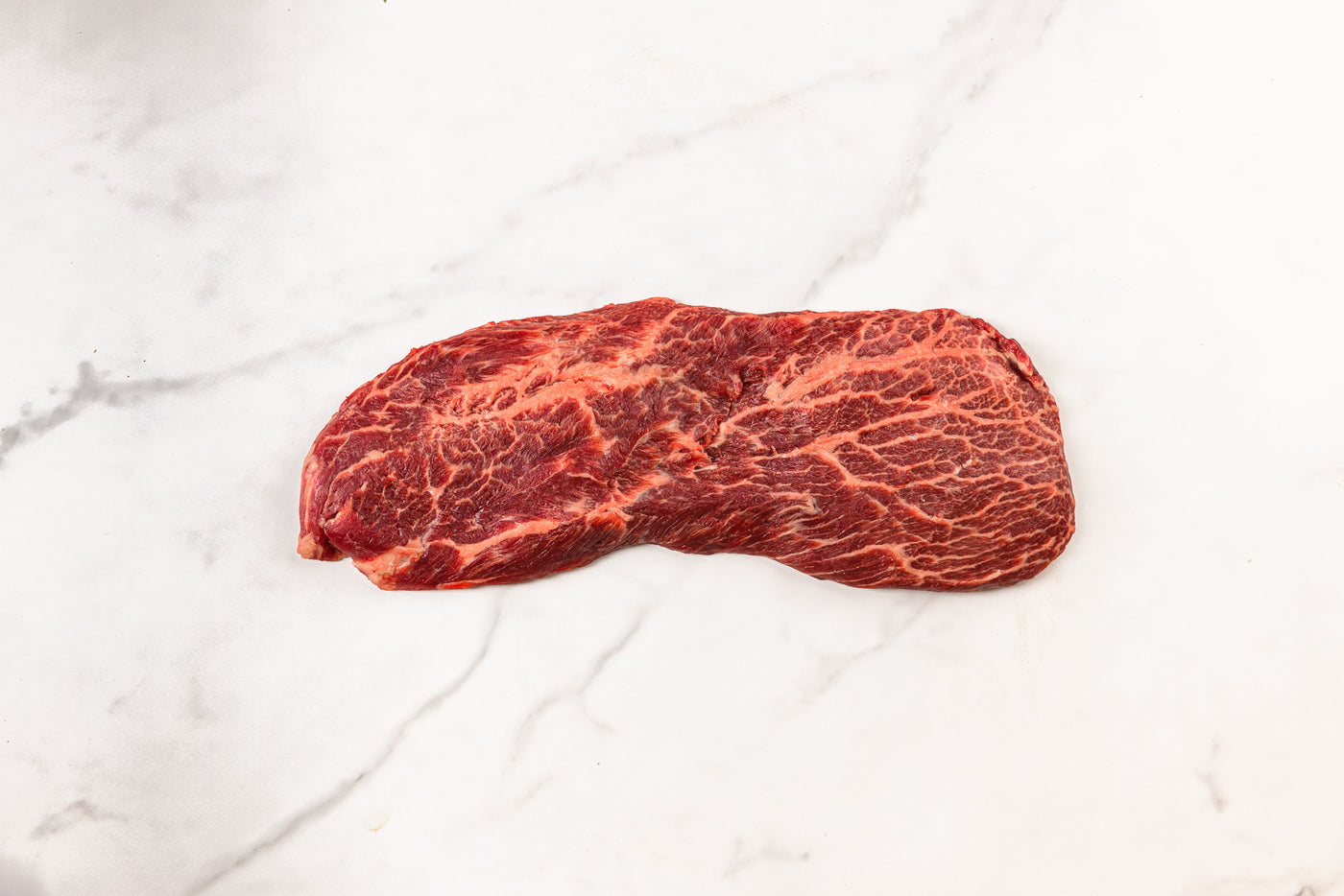 London Broil steak on marble background